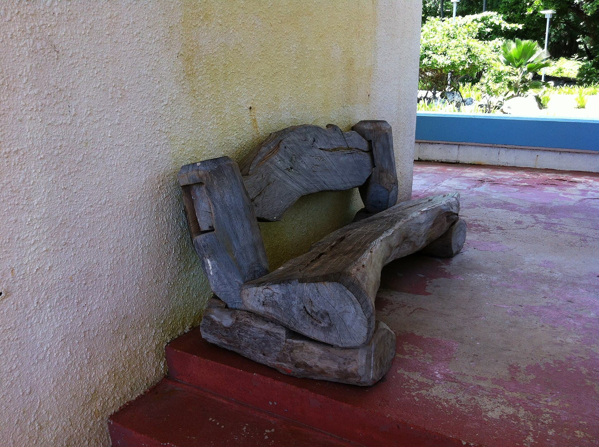 A carved timber bench on the terrace